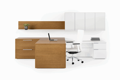 A desk with a laptop and chair in front of it.