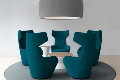 A group of chairs and tables in a room.